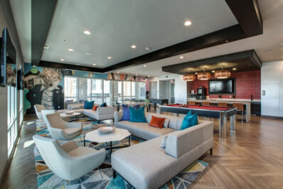 Clubhouse lounge with seating area and pool table